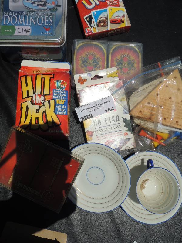 lot 184 image: Dominoes, Uno decks, 2 teacups and ...