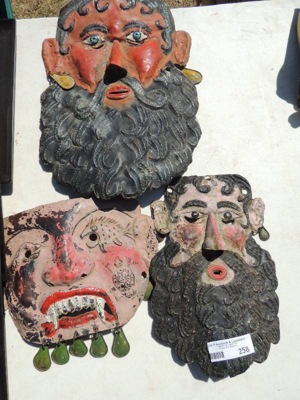 lot 258 image: TRIBAL METAL  masks - MEN WITH BEA...