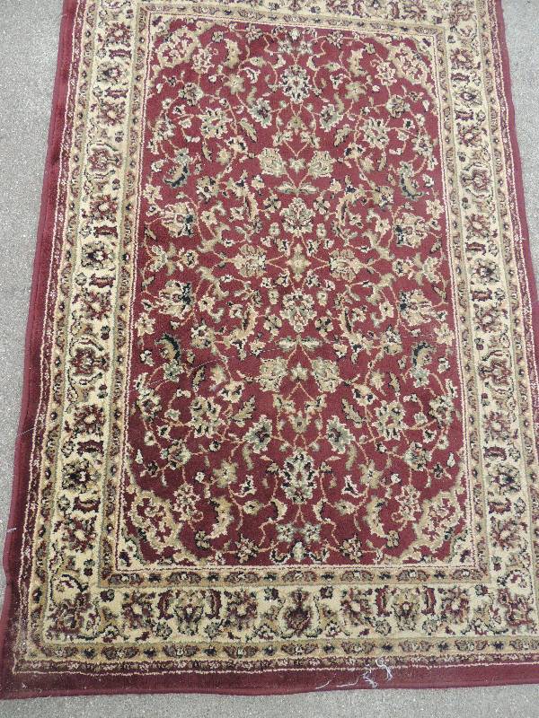lot 24 image: Area rug orange and blues Castillo...