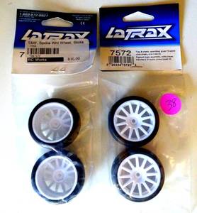 lot 38 image: NEWSEALED - Traxxas 118 LaTrax Rally  2 SLICK TIRES & 12-SPOKE WHITE WHEELS  7572 (2X$)