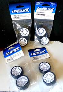 lot 42 image: NEWSEALED - Traxxas 7572 - LaTrax Slick Tires, 12-Spoke Wheels, White (2) (4X$)