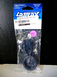 lot 44 image: NEWSEALED - Traxxas 7573A LaTrax Pre-Mounted Slick Tires & 12-Spoke Wheels (Black Chrome) (2)