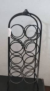 lot 8 image: 8 BOTTLE METAL WINE RACK AS SHOWN.