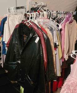 lot 176 image: 4-ARM CLOTHING RACK AS SHOWN. CONTENTS NOT INCLUDED. (DELAYED PICK UP -- AFTER 200PM)