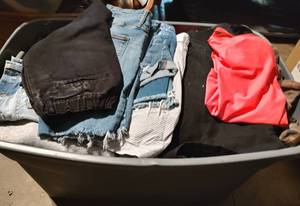lot 194 image: CONTAINER LOT OF ASSORTED CLOTHING AS SHOWN. NICE MIXED LOT