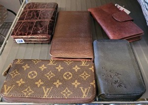lot 128 image: ASSORTED WALLETS INCLUDING LOUIS VUITTON. AUTHENTICITY UNKNOWN
