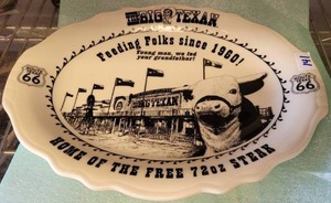 lot 141 image: HOMER LAUGHLIN THE BIG TEXAN HOME OF THE FREE 72OZ STEAK COMMEMORATIVE PLATE.