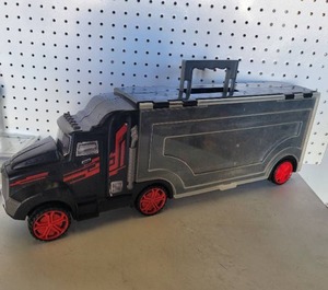 lot 243 image: TOY TRUCK WITH STORAGE ON SIDES.