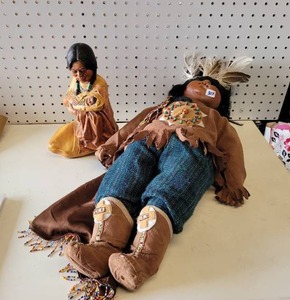 lot 307 image: NATIVE AMERICAN THEMED DOLL AND BANK.