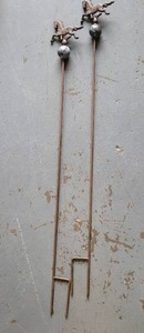 lot 311 image: CAST IRON GARDEN HOSE GUIDES.