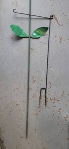 lot 312 image: CAST IRON YARD FLAG HOLDER AND HOSE GUIDE.