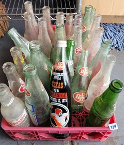 lot 324 image: COCA-COLA CRATE WITH ASSORTED VINTAGE SODA BOTTLES AS SHOWN. CHECK IT OUT