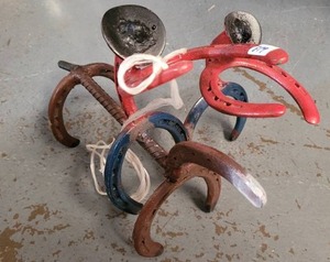 lot 379 image: COWBOYS FIGURE MADE WITH HORSESHOES.