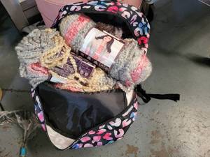 lot 386 image: BACKPACK FULL OF YARN AS SHOWN.