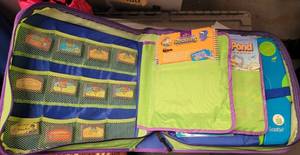 lot 99 image: LEAP FROG PHONICS CARTRIDGES, LEAPPAD, AND BOOKLETS WITH STORAGE BINDER.
