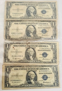 lot 136 image: One 1935 E &amp Three 1935 F $1 Silver Certificates
