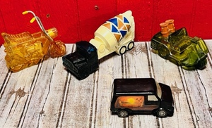 lot 143 image: Four Avon Collectible Cologne Bottle - Vantastic, Mini-Bike, Cement Mixer, &amp Golf Cart
