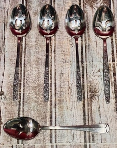 lot 150 image: Four Rogers &amp One Spirit of America Slotted Serving Spoons