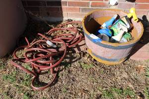 lot 11 image: Yard hose and Planter with Yard Sprays