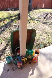 lot 19 image: Wheelbarrow, Citronella Candles, Planter and Yard Sprays
