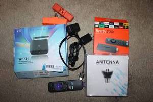 lot 71 image: Fire TV stick (unopened), ZTE Wireless home phone WF721, Antenna digital HDTV Receiver SIP