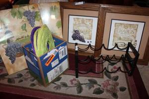 lot 84 image: Pair of wine racks, grape artwork, purple and green paper lanterns