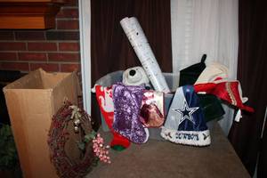 lot 90 image: Christmas Dcor Stockings, Cowboys Santa hat, White Christmas tree, Plush Winter bear