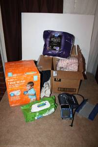 lot 110 image: Adult diapers, kids diapers size 6, and Blood pressure cuff