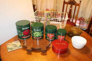 lot 123 image: Del Monte Tin Cannister set, Wooden Pig Trivet, Elfa Storage Bin, Ruffled Green Glass Bowl