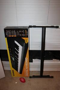 lot 133 image: Casio Digital Keyboard CTK-2400 and Stand