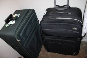 lot 139 image: (2) large suitcases (Pierre Cardin has lock and key)