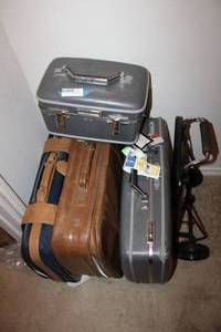 lot 141 image: (4) suitcases and luggage cart