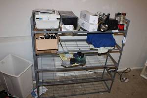 lot 157 image: Contents of Shelf Rack Computer CDs, LED Lights, Emergency lights, cables
