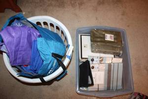 lot 188 image: Unopened Cloth Napkins, valances and curtains, plus laundry basket with reusable shopping bags