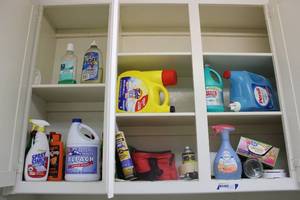 lot 215 image: Laundry Room Contents of cabinets detergents and cleaners