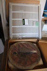 lot 220 image: 18 wall clock still in packaging, and Air vent cover still in packaging