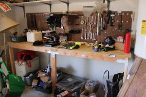 lot 334 image: Wood workbench and peg board (CONTENTS SOLD SEPARATELY)