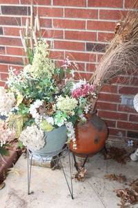 lot 366 image: Plant stands with planters and flower arrangement and tall grass