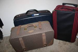 lot 194 image: (3) Suitcases One has leather straps, Samsonite hardcase has pull strap
