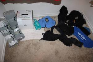 lot 201 image: Foot braces, back and knee supports, spinal fusion therapy machine