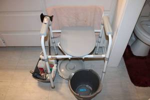 lot 203 image: Portable potty chair, buckets, towels, cane, electric razor
