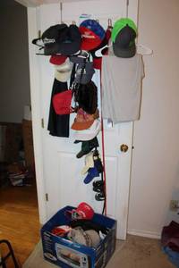 lot 184 image: Over-the-door hat rack and hats as shown