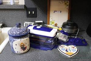 lot 51 image: Mandoline Set, Ceramic Angel cookie jar, Glass Cutting Board, Decorative Tiles, Vintage Burner and Cookware