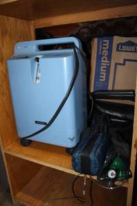 lot 1 image: EverFlo Oxygenator machine with oxygen tanks