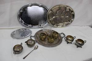 lot 39 image: Silverplate platters, Silver on copper creamer and sugar bowls plus glass centerpiece with glass beads and brass votive holders