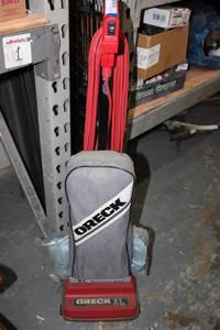 lot 109 image: Oreck Commercial Vacuum with extra bags