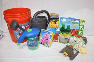 lot 48 image: Gardening lot Liqua Feed, Tomato planter, lawn sprayer and sprinkler, flower seeds