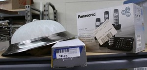 lot 204 image: Housewares unopened Digital cordless phone system, 58 Curtain rod 28-48, and Ceiling light fixture