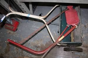 lot 117 image: Large hand saw, yard spreader and sprinkler spike