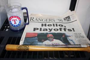 lot 177 image: Baseball Lot Historical newspaper articles, Texas Rangers Mugs, and miniature bat